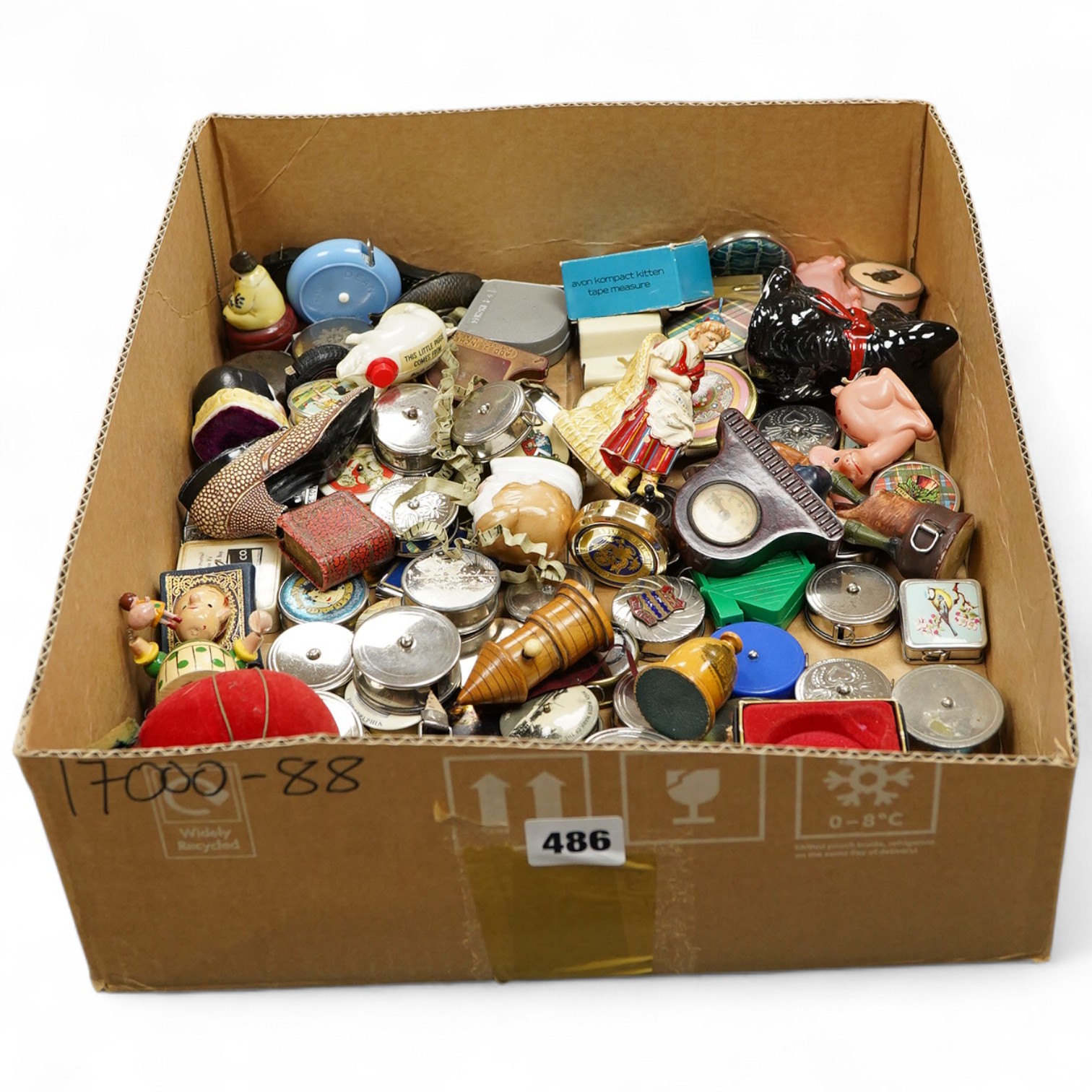 A collection of late 19th and 20th century novelty / souvenir sewing related tape measures